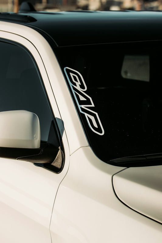 white car with black and white license plate