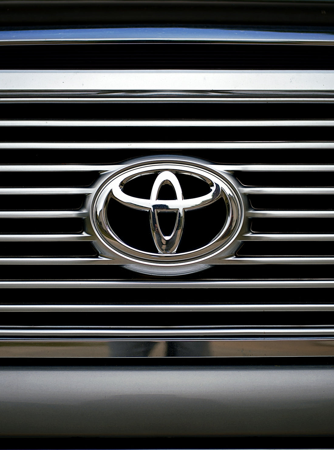 The image shows a toyota grill and logo.